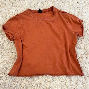 brownish-orange shirt